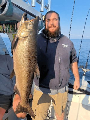 Happy angler with big Lake Ontario fish during the 2024 season.
